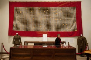 A Sample of a Community Service Flag. This is the WWI service flag of Boone County, Missouri. The stars represent 1534 sons of Boone County who fought in WWI. Gold stars commemorate those lost in the war. Photo credit: Columbia Tribune. 