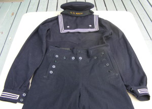 A vintage US Navy "crackerjack" uniform showing the 13 button front flap. Image credit: Imperial Antiques