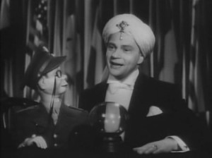 Renowned ventriloquist Edgar Bergen and his sidekick Charlie McCarthy in the movie Stage Door Canteen.    